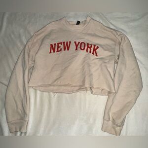 Forever 21 Beige Colored with Red Text “New York” sweatshirt.